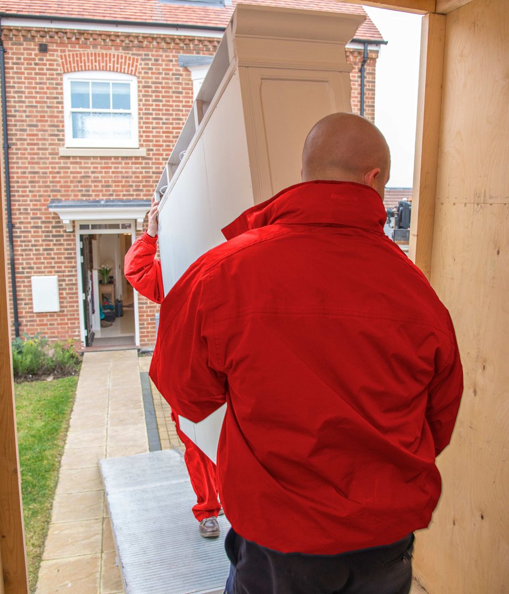 2 of the move team carrying a unit
