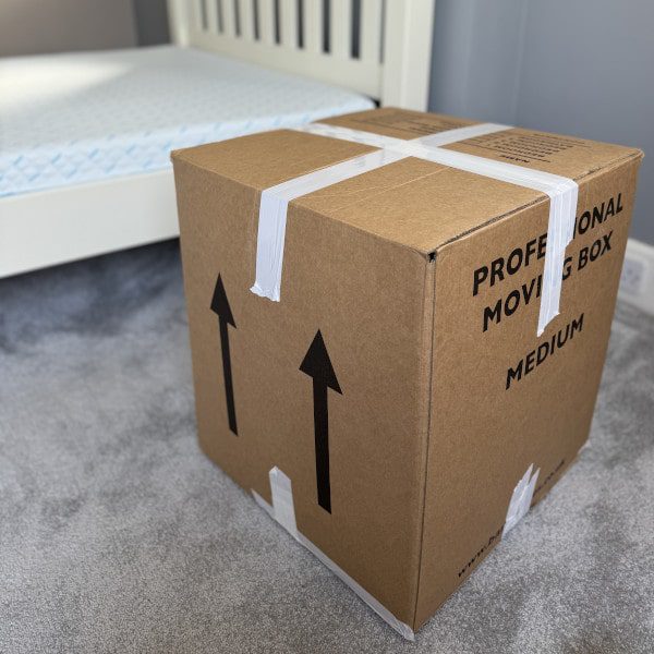 packing box in front of bed