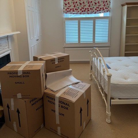 packing boxes by bed