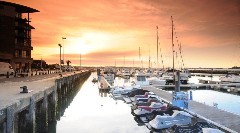 poole quay with the sun setting