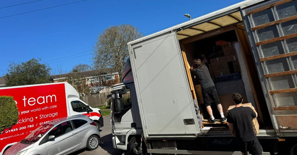 Professional removals team helping a family move house in Poole