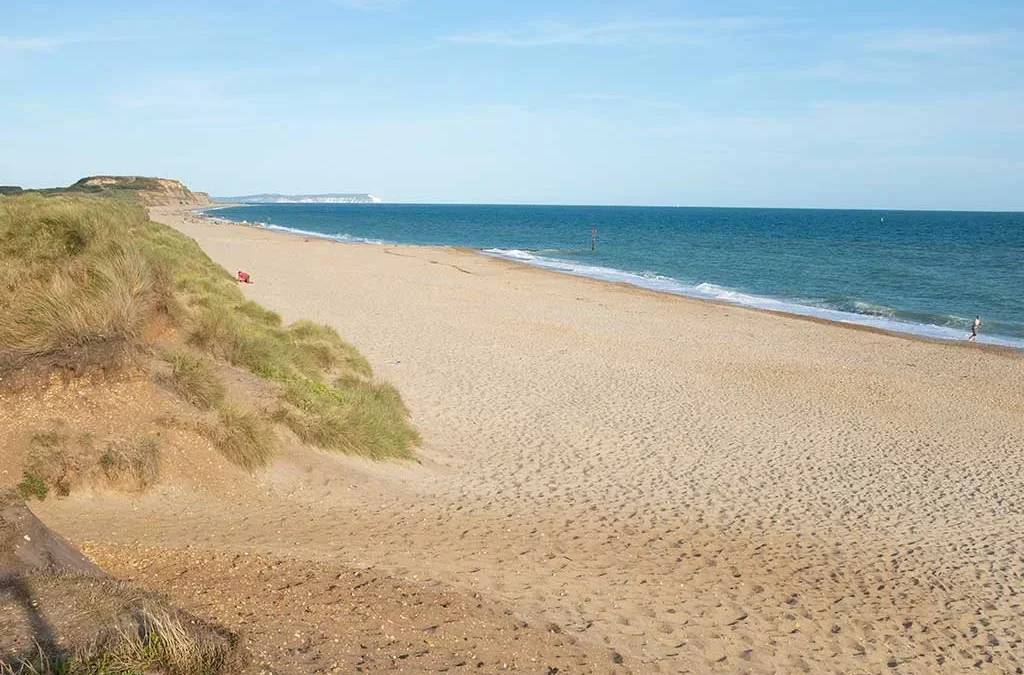 Golden sand and blue waters at Southbourne Beach Dorset for area relocation guide