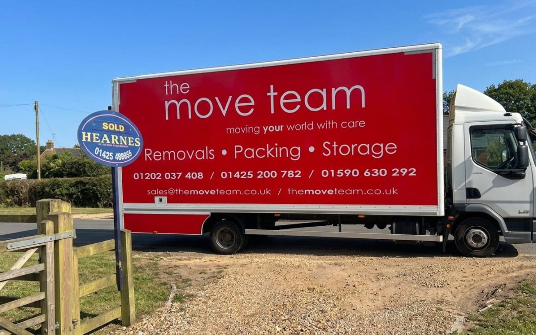 Bournemouth removals team loading a moving van near the coast